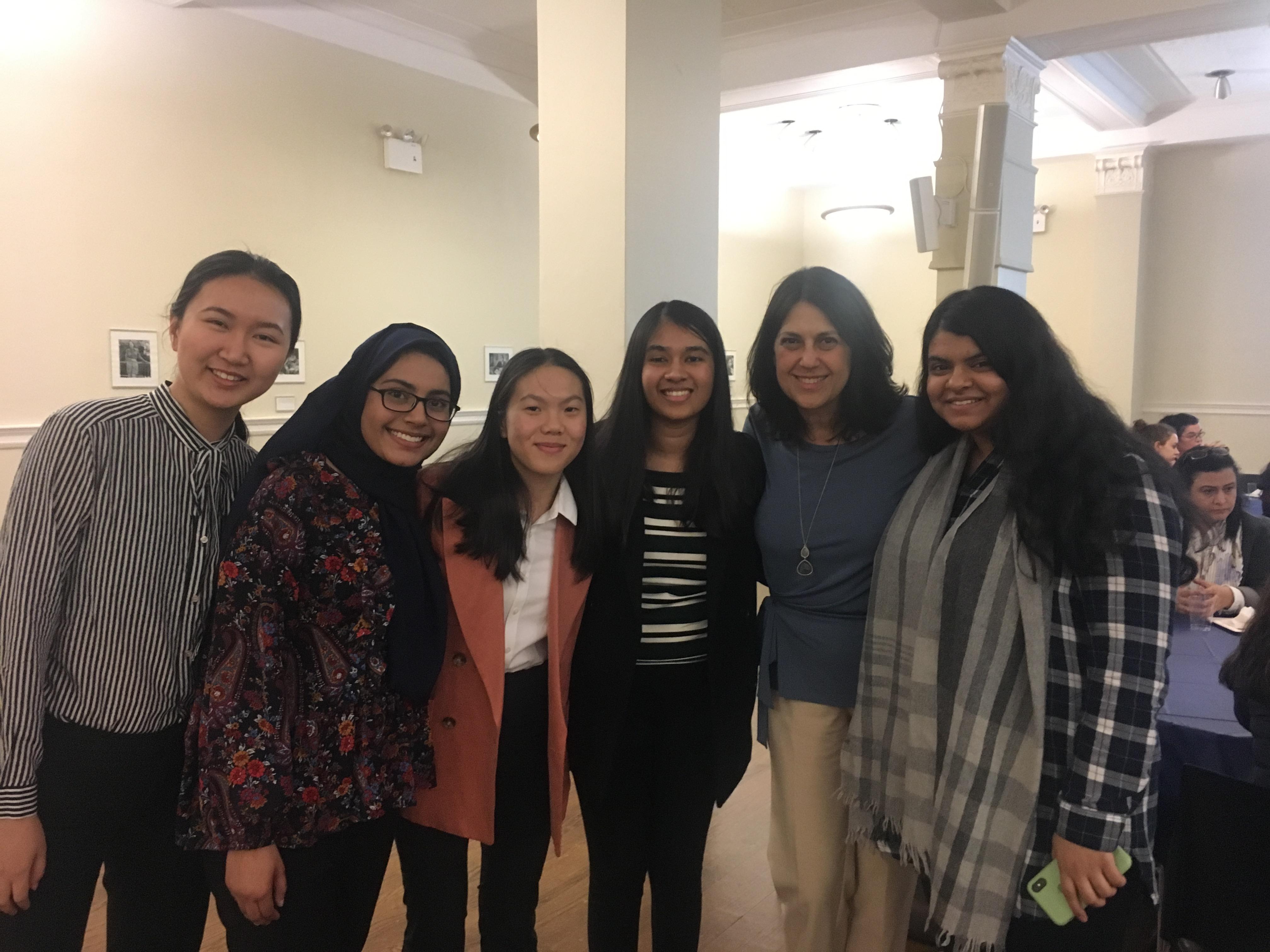 Group of students and alumnae at a health professions event.